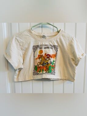 Crop Top by La Luna in a “cowgirl” design.  Size women’s medium.  100% cotton.